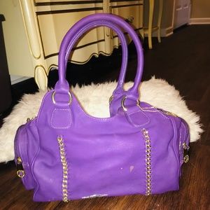 Purple designer handbag